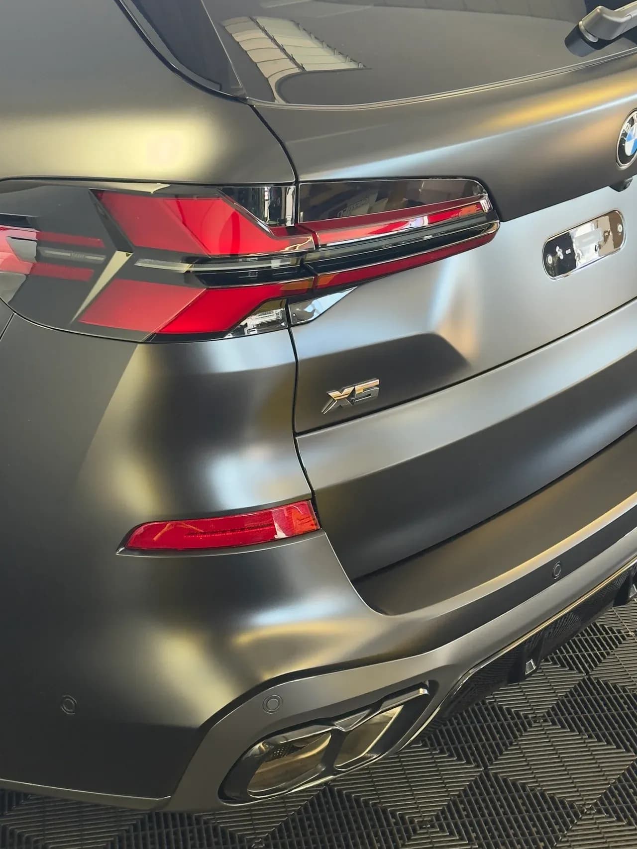 Matte colour change wrap on a BMW X5, rear detail