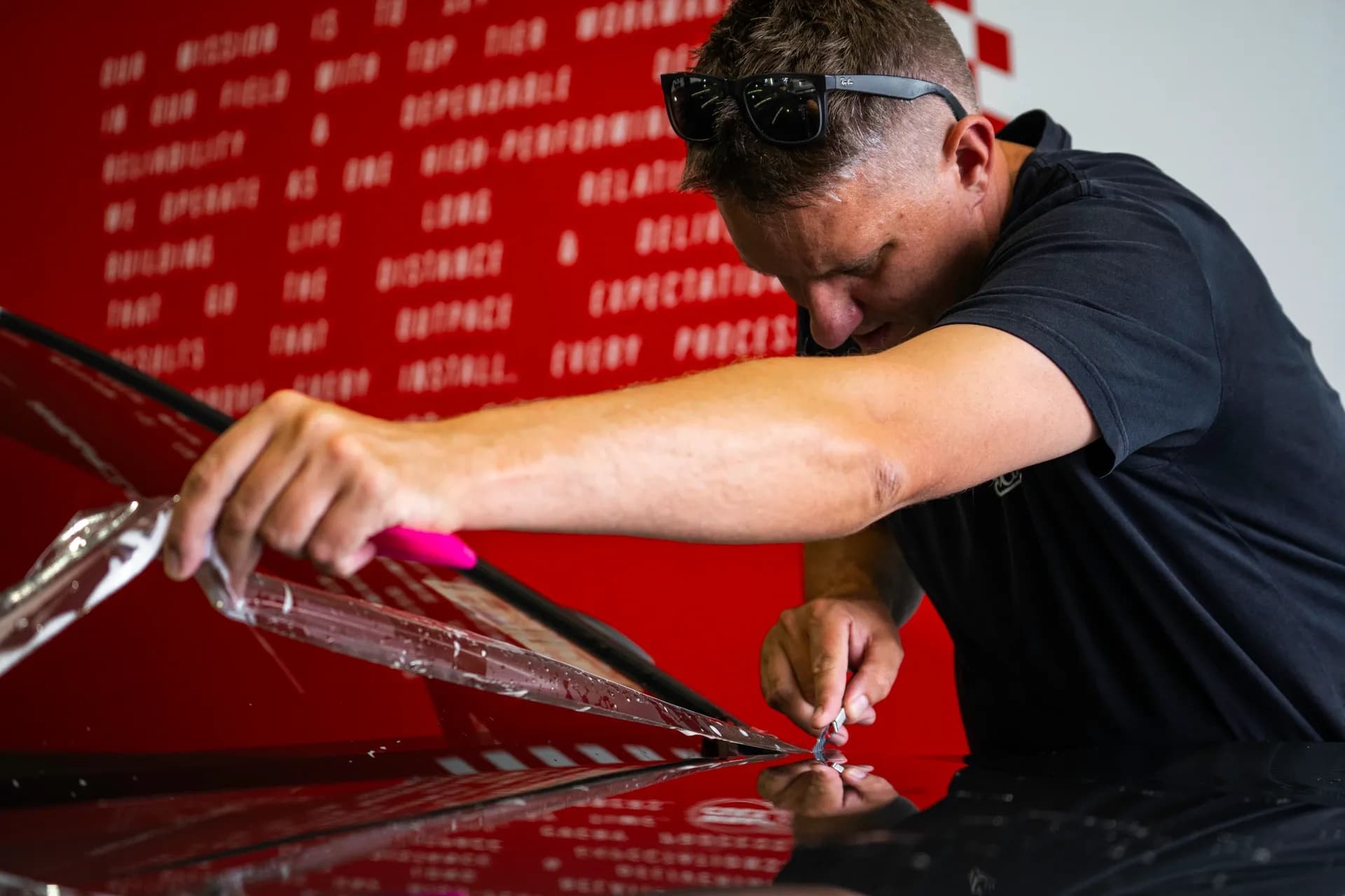 Wrap Culture technician applying paint protection film to a vehicle bonnet