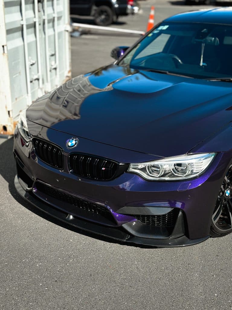 Ceramic coated BMW with colour-shifting wrap