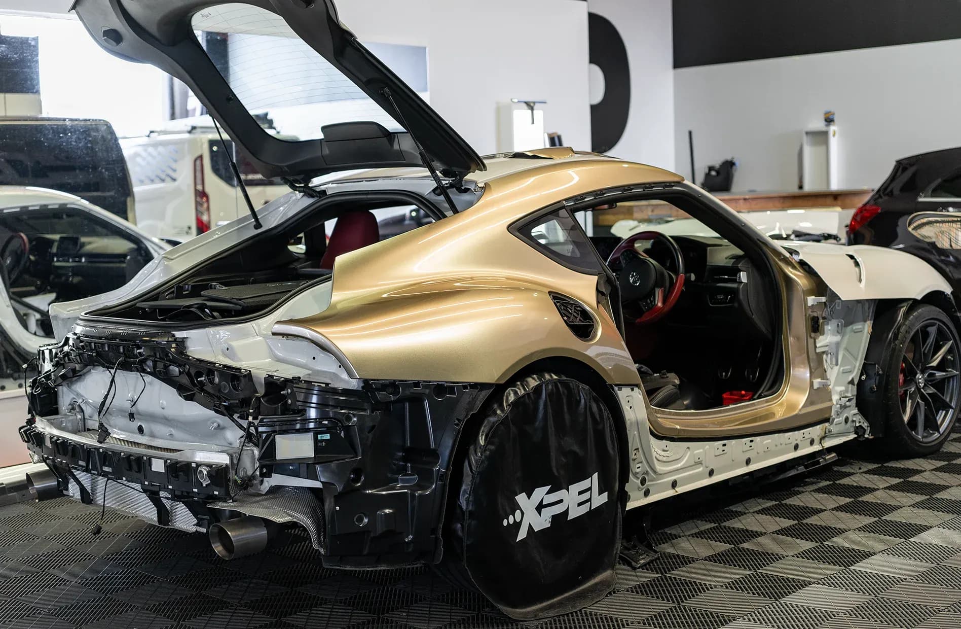Gold ppf wrap partially applied to car